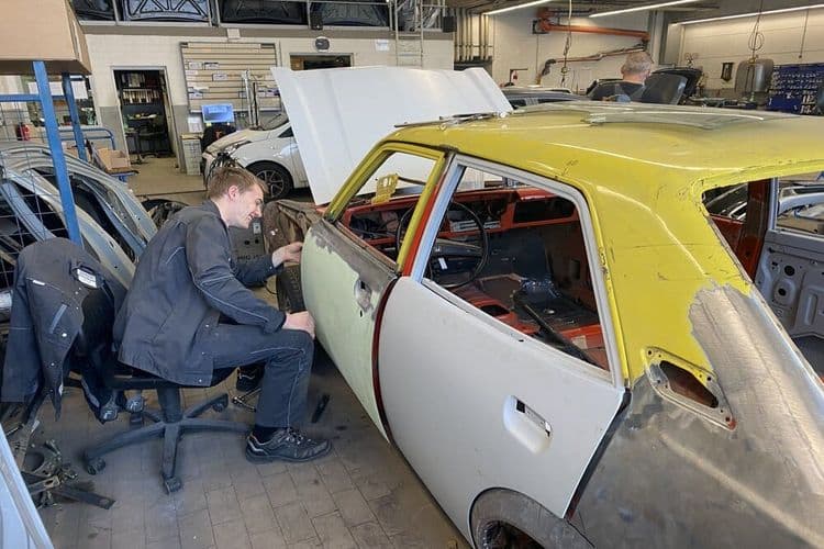 Apprentice works on the Mitsubishi Lancer